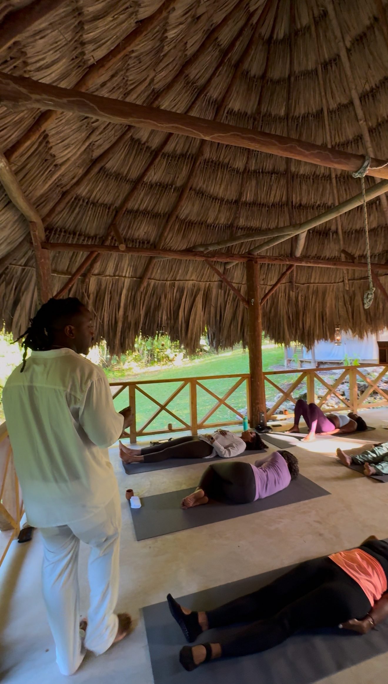 Ceremony participants in savasana